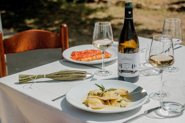 Wine and fresh pasta at outdoor picnic table, Terrae Eremis, Abruzzo, Italy