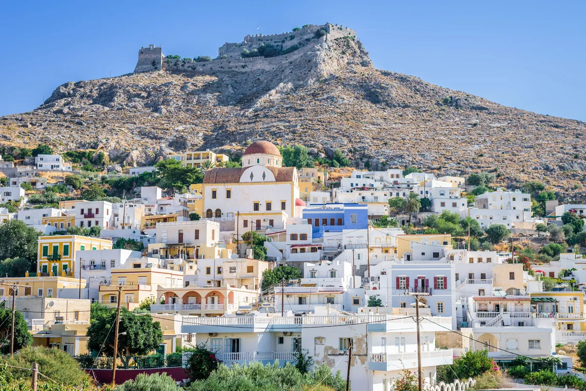 A white town and castle on a hill on the island of Patmos, Dodecanese, Greece